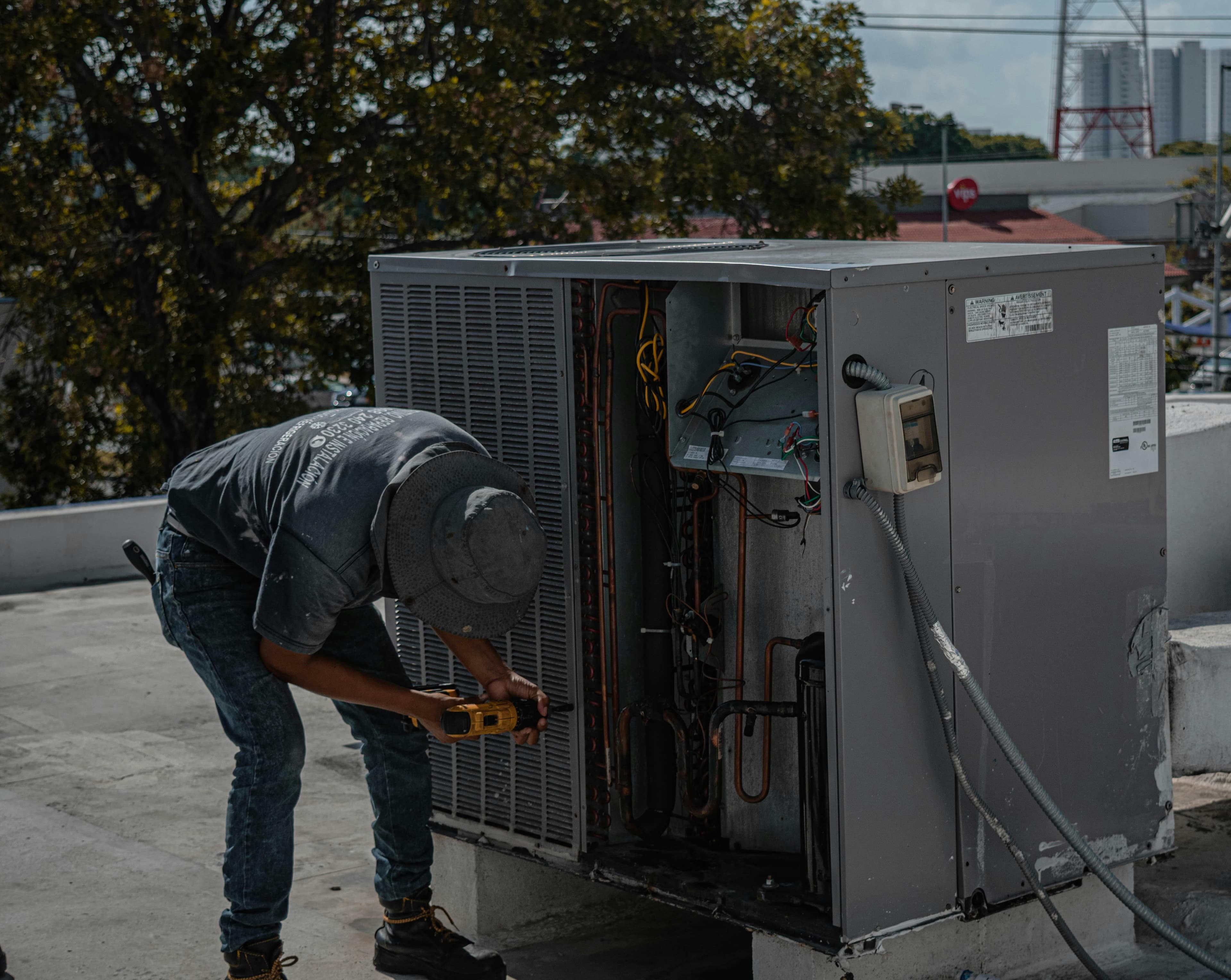 HVAC technician inspecting equipment